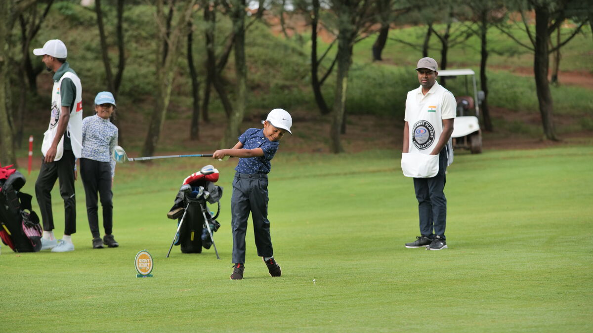 Shinav swinging on the golf course